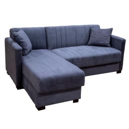 Γωνιακός καναπές που γίνεται κρεβάτι, βελούδινος σε γκρι χρώμα, μαζί με δυο ίδιου χρώματος διακοσμητικά μαξιλάρια με αποθηκευτικό χώρο.